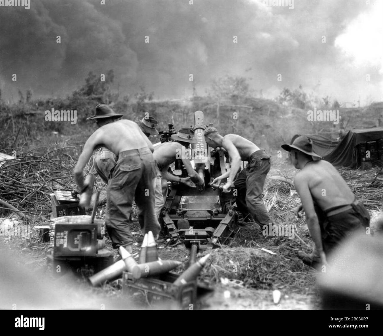 The Battle of Balikpapan was the concluding stage of Operation Oboe. The landings took place on 1 July 1945. The Australian 7th Division, composed of the 18th, 21st and 25th Infantry Brigades, with Dutch East Indies troops, made an amphibious landing a few miles north of Balikpapan, on the island of Borneo. The landing had been preceded by heavy bombing and shelling by Australian and US air and naval forces. The Japanese were outnumbered and outgunned, but like the other battles of the Pacific War, many of them fought to the death.  Major operations had ceased by July 21. The 7th Division's ca Stock Photo