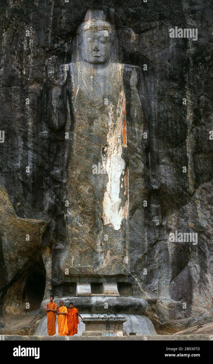 The remote ancient Buddhist site of Buduruvagala (which means ‘stone Buddha images’ in Sinhalese) is thought to date from the 10th century, when Mahayana Buddhism dominated parts of Sri Lanka. Carved into the rock face is a huge 16m-high Buddha figure, with three smaller figures on either side. These are thought to represent the Maitreya Buddha, Avalokitesvara and his consort Tara, as well as the Hindu god Vishnu. Stock Photo