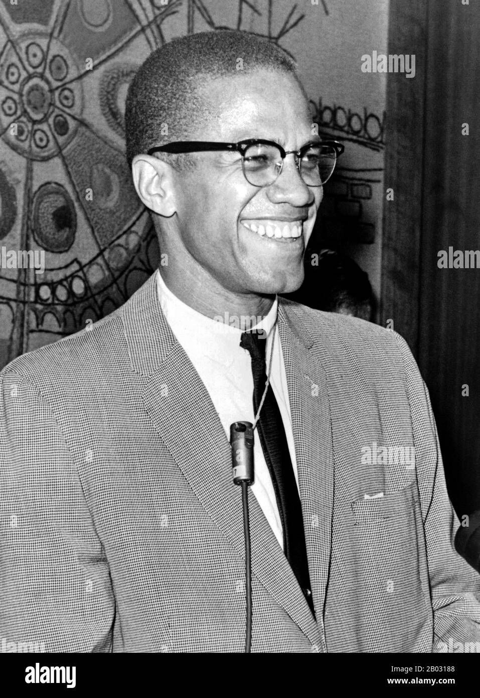 Malcolm X ( May 19, 1925 – February 21, 1965), born Malcolm Little and also known as el-Hajj Malik el-Shabazz, was an American Muslim minister and a human rights activist.  To his admirers he was a courageous advocate for the rights of blacks, a man who indicted white America in the harshest terms for its crimes against black Americans; detractors accused him of preaching racism and violence. He has been called one of the greatest and most influential African Americans in history. Stock Photo