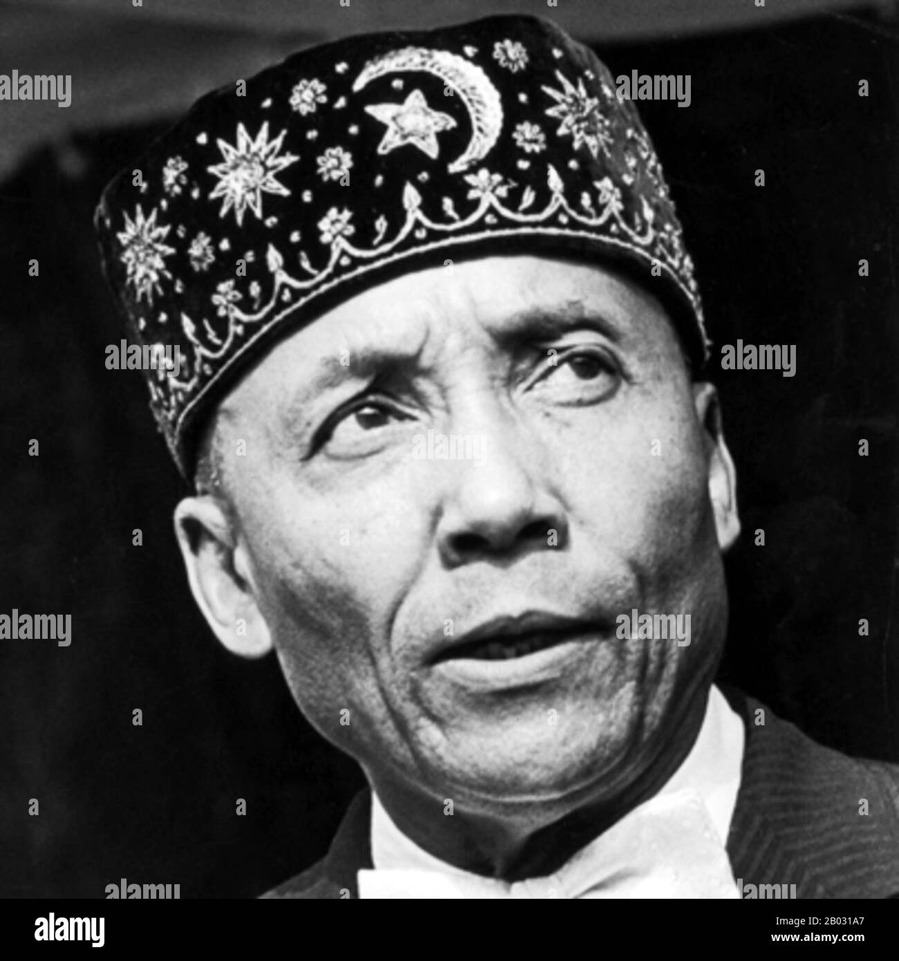Elijah Muhammad, son of a sharecropper, was born into poverty in Sandersville, Georgia, on October 7, 1897. After moving to Detroit in 1923, he met W. D. Fard, founder of the black separatist movement Nation of Islam.  Muhammad became Fard’s successor from 1934-75 and was known for his controversial preaching. His followers included Malcolm X and Louis Farrakhan. He died February 25, 1975, in Chicago. Stock Photo