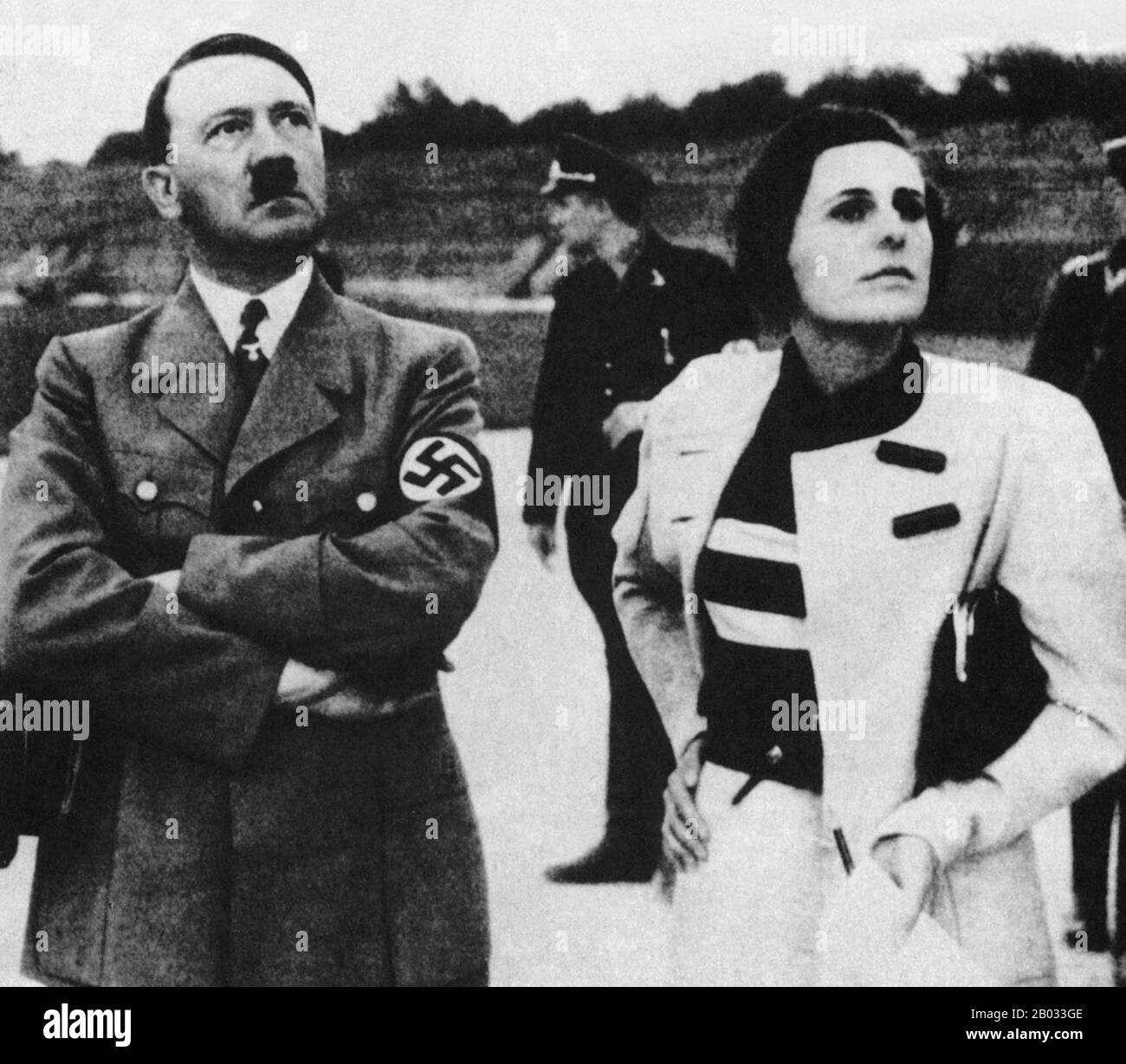 Helene Bertha Amalie 'Leni' Riefenstahl (22 August 1902 – 8 September 2003) was a German film director, producer, screenwriter, editor, photographer, actress, dancer, and propagandist for the Nazis.  Adolf Hitler (20 April 1889 – 30 April 1945) was a German politician of Austrian origin who was the leader of the Nazi Party (NSDAP), Chancellor of Germany from 1933 to 1945, and Fuhrer ('leader') of Nazi Germany from 1934 to 1945.  As dictator of Nazi Germany he initiated World War II in Europe and was a central figure of the Holocaust. Stock Photo