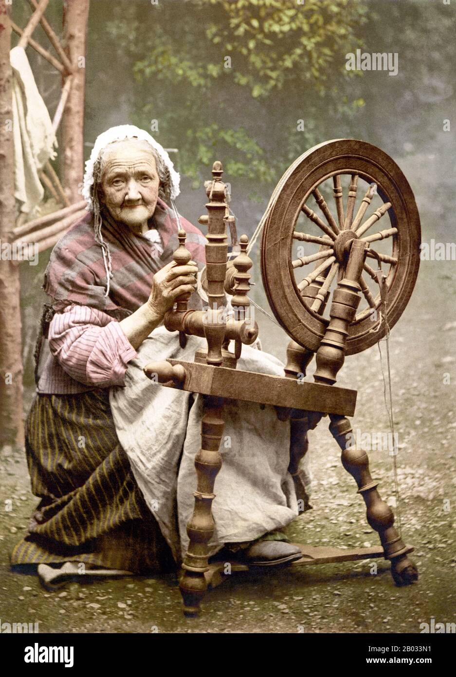A spinning wheel is a device for spinning thread or yarn from natural or synthetic fibres. Spinning wheels appeared in China, probably in the 11th century, and very gradually replaced hand spinning with spindle and distaff.  Spinning machinery, such as the spinning jenny and spinning frame, displaced the spinning wheel during the Industrial Revolution. Stock Photo