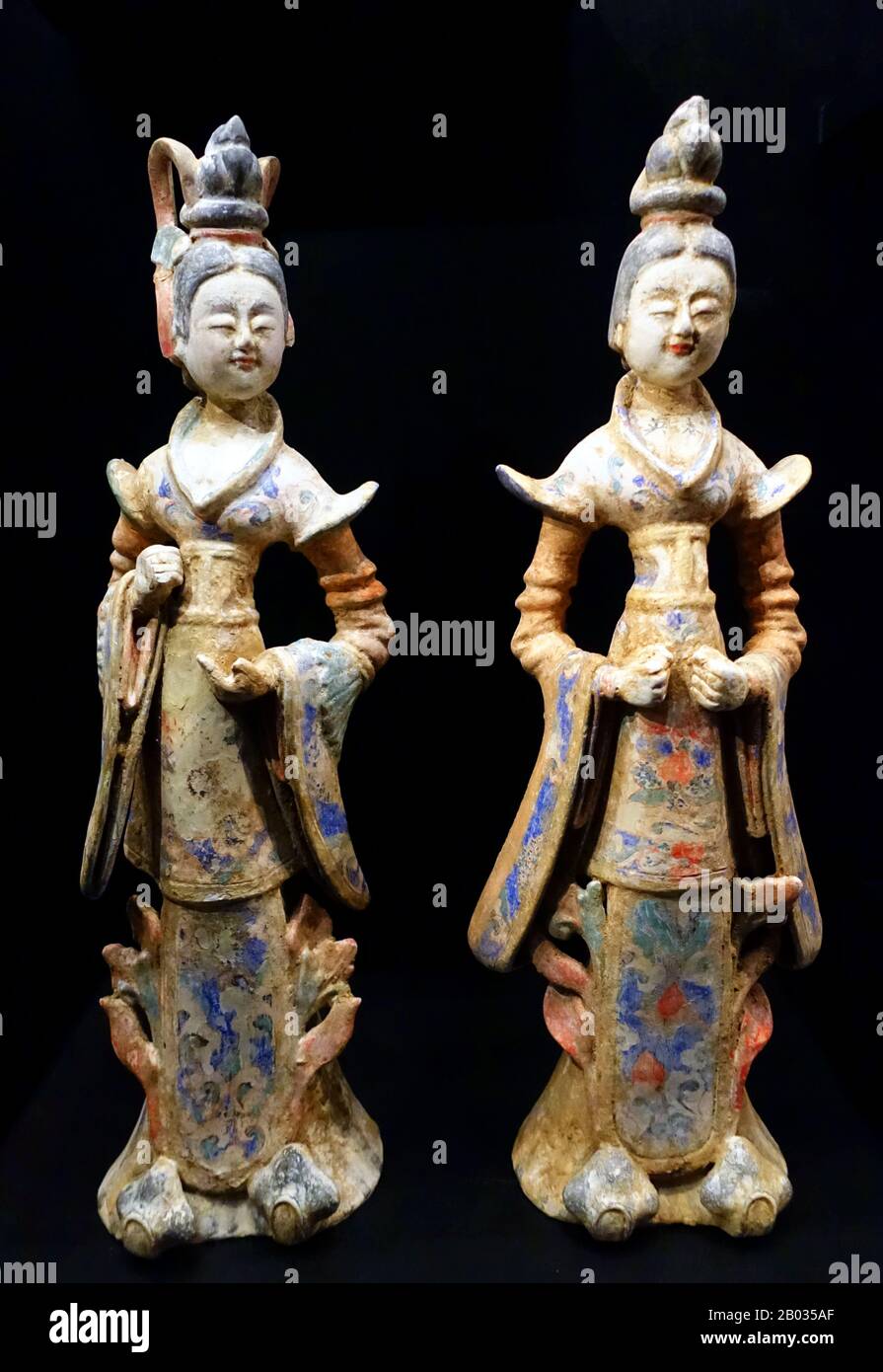 The Tang Dynasty ( June 18, 618 – June 1, 907) was an imperial dynasty of China preceded by the Sui Dynasty and followed by the Five Dynasties and Ten Kingdoms Period. It was founded by the Li family, who seized power during the decline and collapse of the Sui Empire. The dynasty was interrupted briefly by the Second Zhou Dynasty (October 8, 690 – March 3, 705) when Empress Wu Zetian seized the throne, becoming the first and only Chinese empress regnant, ruling in her own right.  A fixed group of figures was generally positioned just outside the burial chamber in Tang tombs. This generally con Stock Photo
