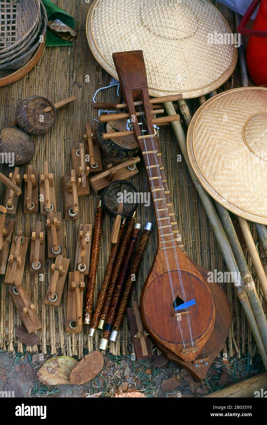 The sueng (also spelled seung or süng) is a plucked fretted lute from the northern region of Thailand. The instrument is made from hardwood and its strings (numbering either four or six and arranged in courses of two) are most often made of steel wire. It has nine bamboo frets.  The sueng is part of a northern Thai traditional ensemble called the salo-so (saw)-sueng ensemble, along with the salo (3-string spike fiddle) and pi so (free reed pipe). Stock Photo