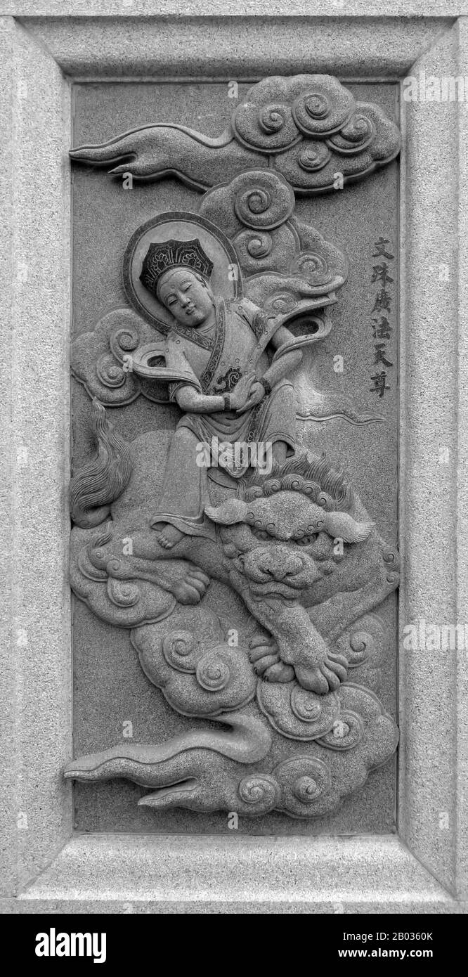 Malaysia / China: Carving of the 'superiorman' Wenshu Guangfa Tianzun, depicting his role in the 16th Century Ming Dynasty novel Fengshen Yanyi ('Investiture of the Gods'). From Ping Sien Si Temple, Pasir Panjang Laut. Photo by Anandajoti (CC BY 2.0). Wenshu Guangfa Tianzun was a character in the Ming Dynasty novel 'Fengshen Yanyi', a 'superiorman' who looked after Mount Five Dragons and Cloud Top Cave. He is apparently derived from the bodhisattva Manjusri, and was the noted teacher of Jinzha, Li Jing's first son. Stock Photo