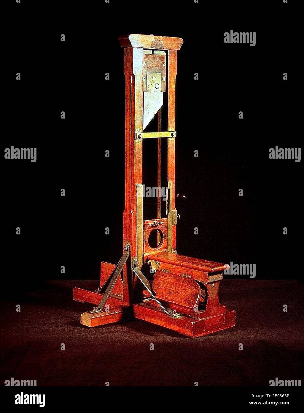 A guillotine is an apparatus designed for efficiently carrying out  executions by beheading. The device consists of a tall, upright frame in  which a weighted and angled blade is raised to the
