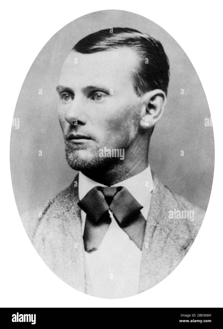 Jesse Woodson James (September 5, 1847 – April 3, 1882) was an American outlaw, guerrilla, gang leader, bank robber, train robber, and murderer from the state of Missouri and the most famous member of the James-Younger Gang.   Jesse and his brother Frank James were Confederate guerrillas during the Civil War. They were accused of participating in atrocities committed against Union soldiers, including the Centralia Massacre. After the war, as members of various gangs of outlaws, they robbed banks, stagecoaches, and trains.   On April 3, 1882, Jesse James was killed by Robert Ford, a member of h Stock Photo