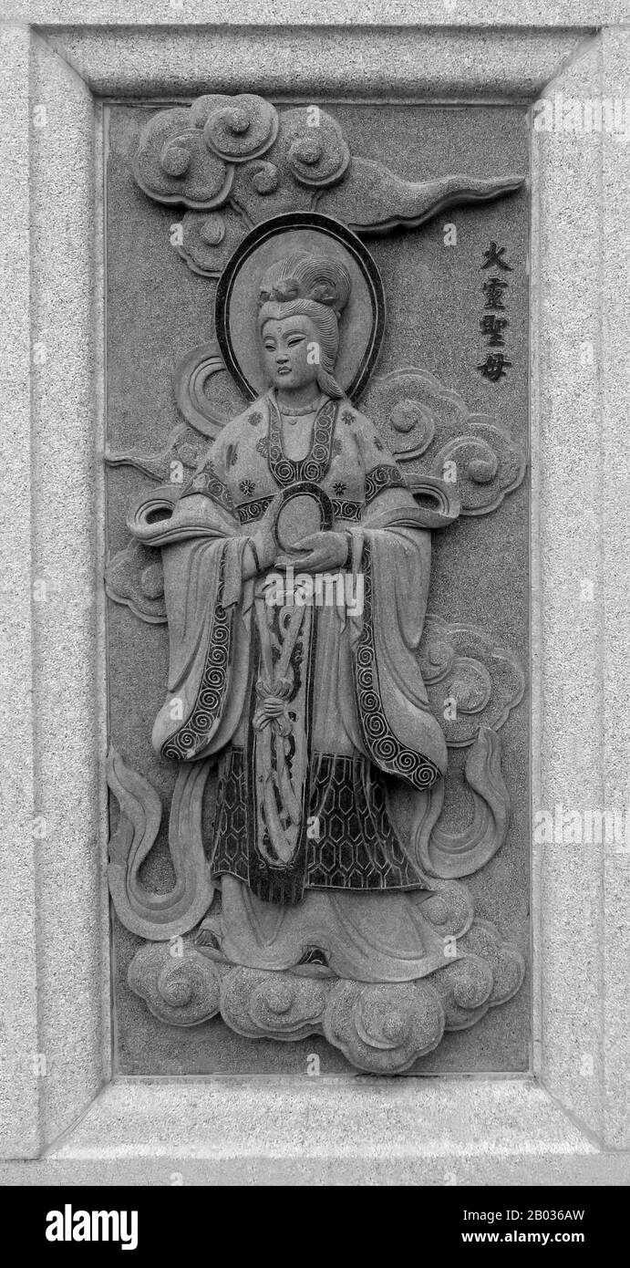Malaysia / China: Carving of the goddess Xiwangmu (Huo Ling Shengmu), Queen Mother of the West, depicting her role in the 16th Century Ming Dynasty novel Fengshen Yanyi ('Investiture of the Gods'). From Ping Sien Si Temple, Pasir Panjang Laut. Photo by Anandajoti (CC BY 2.0). Xiwangmu, also known by many other local names and titles, is a major goddess in Chinese folk religion and mythology. Associated with eternal bliss, longevity and prosperity, worship of Xiwangmu may date back all the way to the 15th century BCE, though she is mainly associated with Taoism. Stock Photo