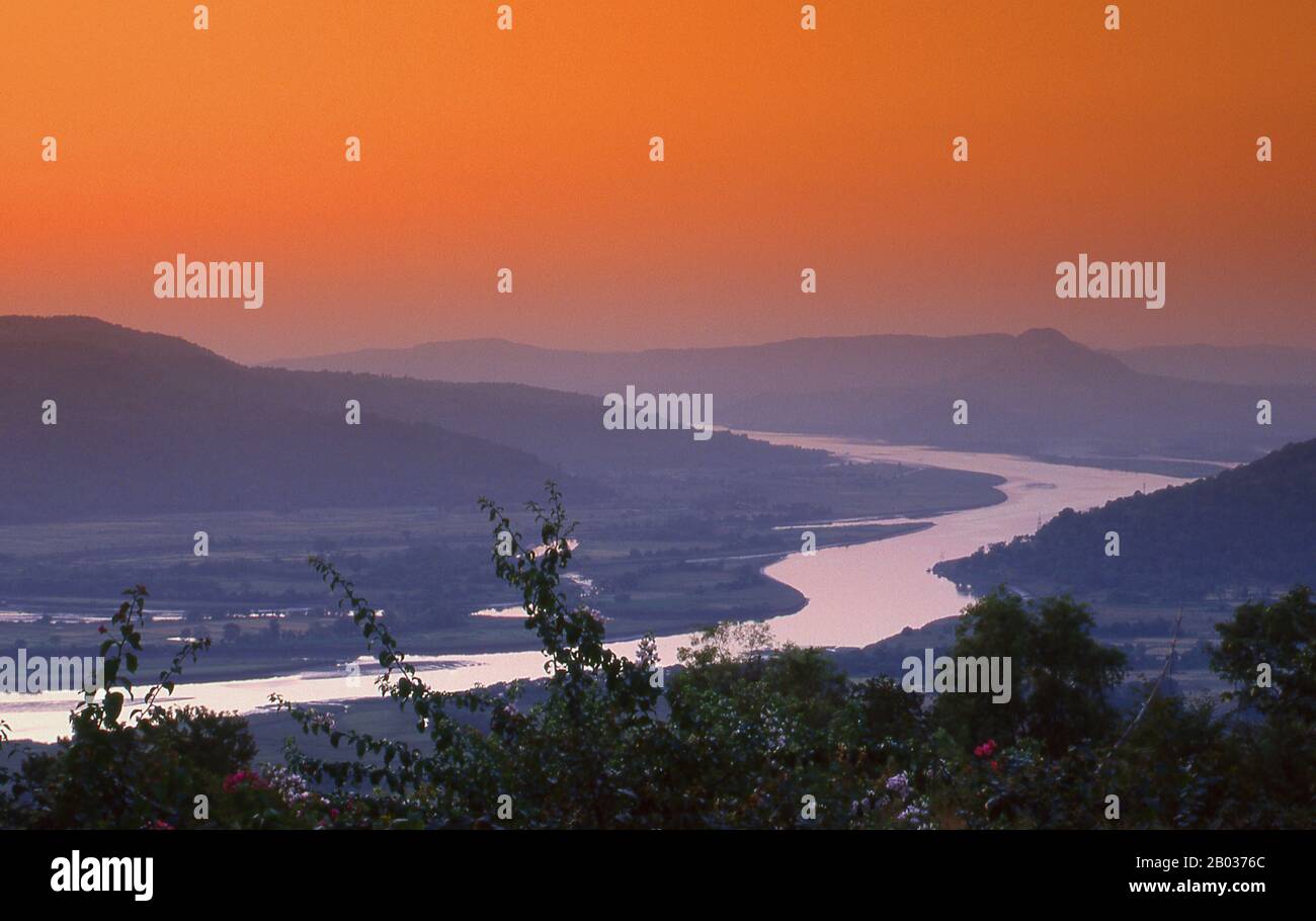 The Vashishti River is one of the larger rivers on the Konkan coast of Maharashtra State. The town of Chiplun lies on its banks.  The river begins in the Western Ghats and snakes its way westwards towards the Arabian Sea. Kolkewadi Dam, near Alore has a vast reservoir which feeds a tributary of the river.  The river has many riverine islands. Crocodiles are known to inhabit the waters. Stock Photo