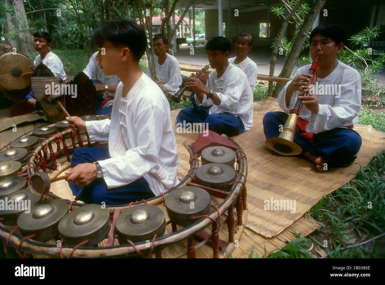 A piphat is a kind of ensemble in the classical music of Thailand, which features wind and percussion instruments. It is considered the primary form of ensemble for the interpretation of the most sacred and 'high-class' compositions of the Thai classical repertoire, including the Buddhist invocation entitled sathukan as well as the suites called phleng rueang. It is also used to accompany traditional Thai theatrical and dance forms including khon (masked dance-drama), lakhon (classical dance), and shadow puppet theater. Stock Photo