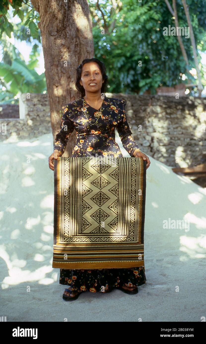 Kunaa weaving is an exclusively female occupation. The women of Gadu cross regularly to the neighbouring island of Gan where they harvest an especially resilient grass known as hau. This is then coloured with a variety of natural dyes before being woven into traditional designs on a simple loom.  The designs are traditional, handed down from mother to daughter from generation to generation. By the mid-17th century so prized had Gadu kunaa become in the neighbouring Indian Ocean region that they were sent as part of the annual tribute from the Maldivian Sultan to the Kingdom of Sri Lanka. Stock Photo