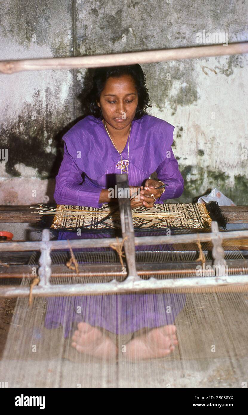 Kunaa weaving is an exclusively female occupation. The women of Gadu cross regularly to the neighbouring island of Gan where they harvest an especially resilient grass known as hau. This is then coloured with a variety of natural dyes before being woven into traditional designs on a simple loom.  The designs are traditional, handed down from mother to daughter from generation to generation. By the mid-17th century so prized had Gadu kunaa become in the neighbouring Indian Ocean region that they were sent as part of the annual tribute from the Maldivian Sultan to the Kingdom of Sri Lanka. Stock Photo