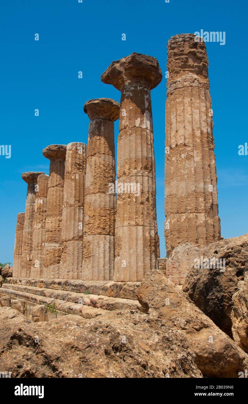 Agrigento was founded on a plateau overlooking the sea, with two nearby rivers, the Hypsas and the Akragas, and a ridge to the north offering a degree of natural fortification. Its establishment took place around 582–580 BCE and is attributed to Greek colonists from Gela, who named it 'Akragas'.  Akragas grew rapidly, becoming one of the richest and most famous of the Greek colonies of Magna Graecia (Greater Greece). It came to prominence under the 6th-century tyrants Phalaris and Theron, and became a democracy after the overthrow of Theron's son Thrasydaeus.  Although the city remained neutra Stock Photo