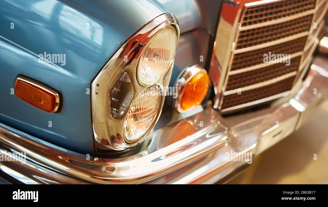Detail of classic car. Closeup of headlight of the museum of vintage
