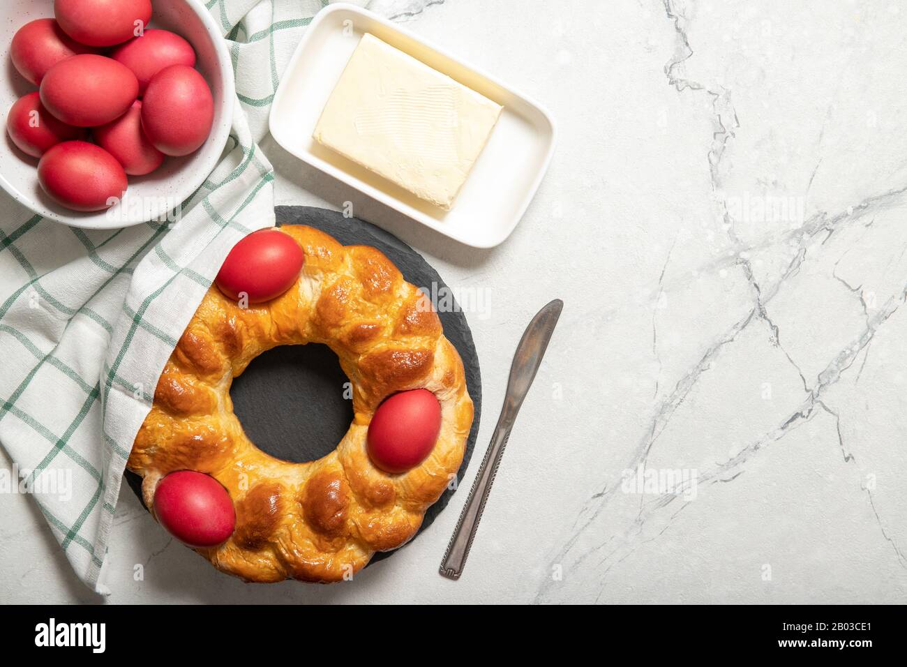 Tasty easter bread. Easter bread and red eggs. Italian easter bread.Place for text Stock Photo