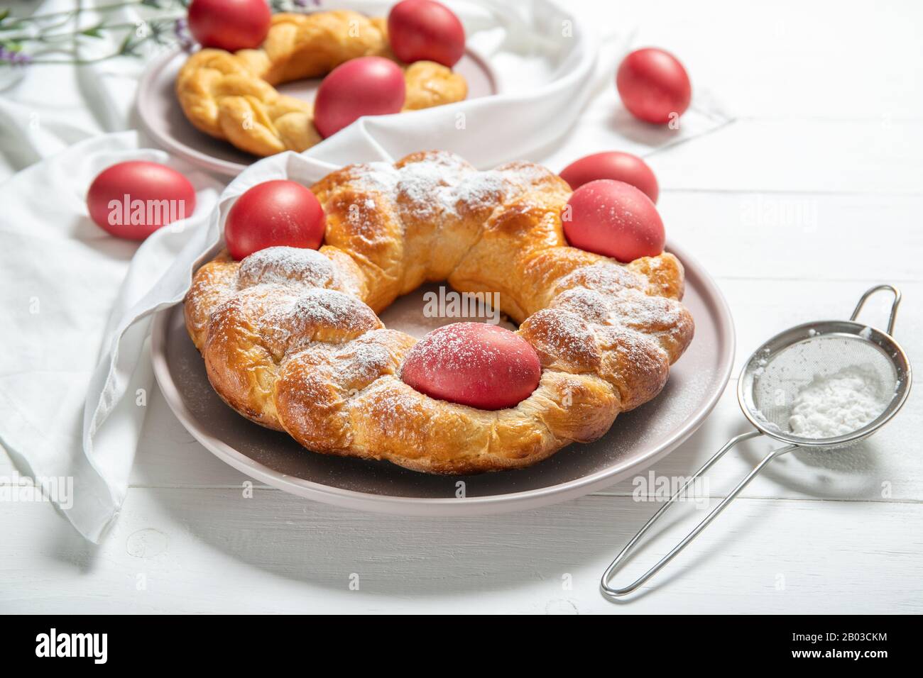 Tasty easter bread. Easter bread and red eggs. Italian easter bread Stock Photo
