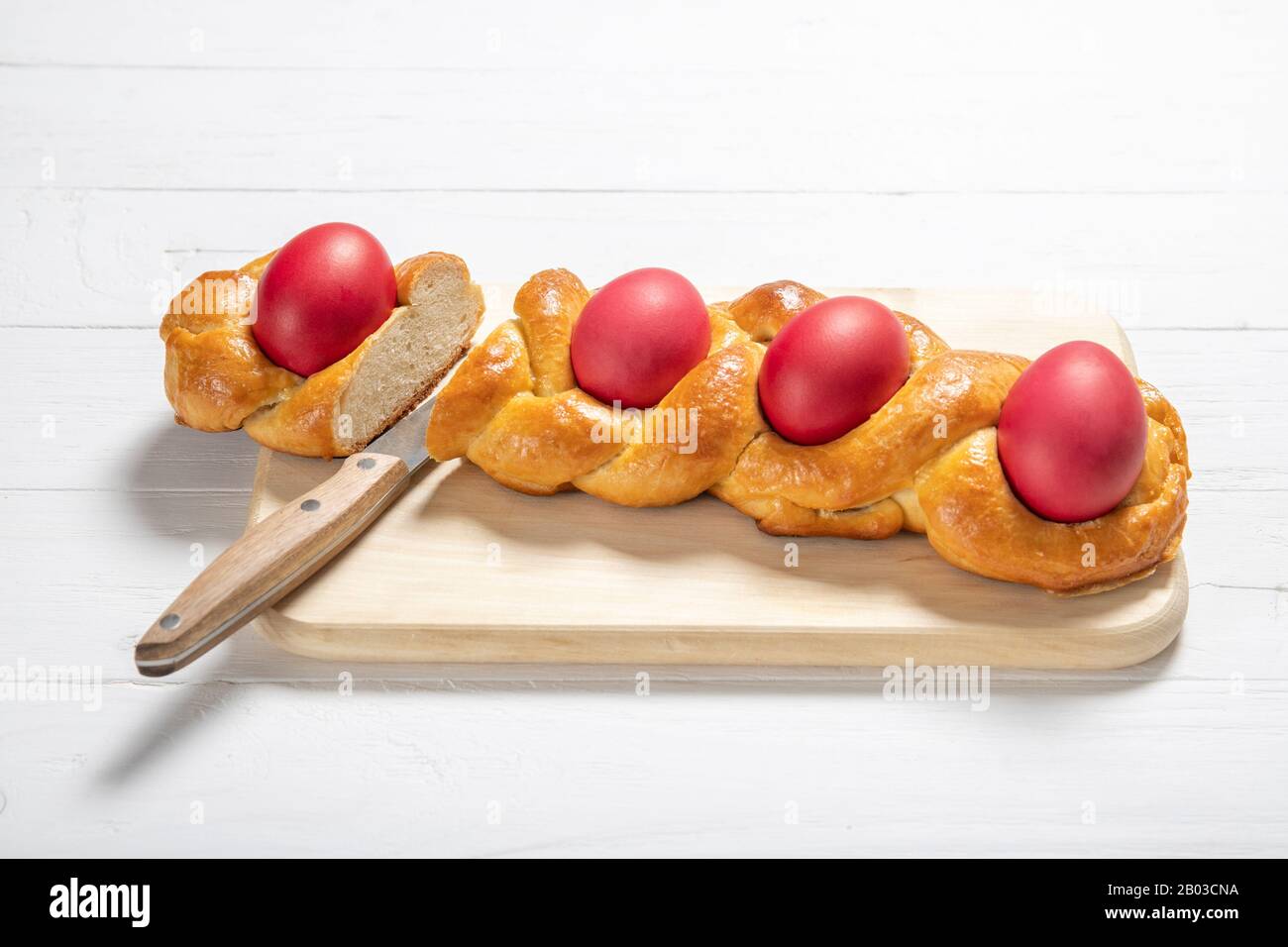 Tasty easter bread. Easter bread and red eggs. Italian easter bread Stock Photo