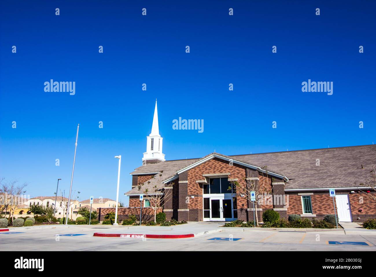 Entrance To Neighborhood Church With Spire Steeple Stock Photo
