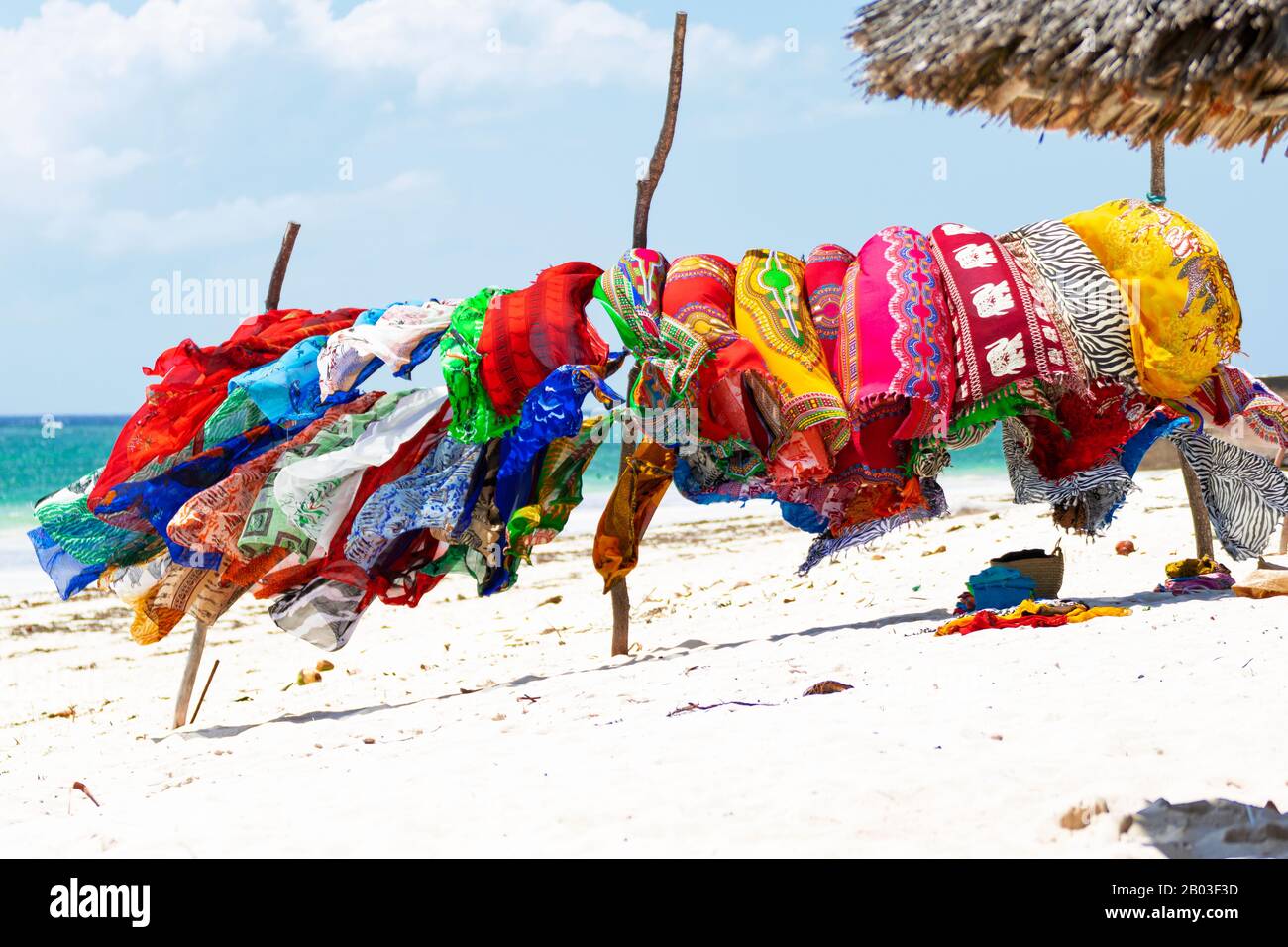Multicolored textiles on the beach Stock Photo - Alamy