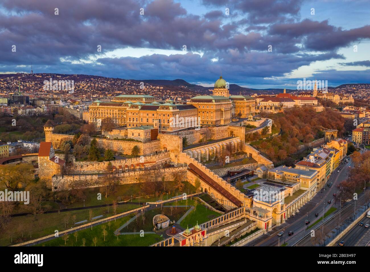 Budapest, Hungary - Aerial view of Buda Castle Royal Palace at sunrise with Matthias Church and Buda Tunnel at autumn Stock Photo