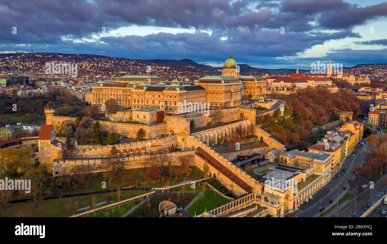 Budapest, Hungary - Aerial view of Buda Castle Royal Palace at sunrise with Matthias Church and Buda Tunnel at autumn Stock Photo