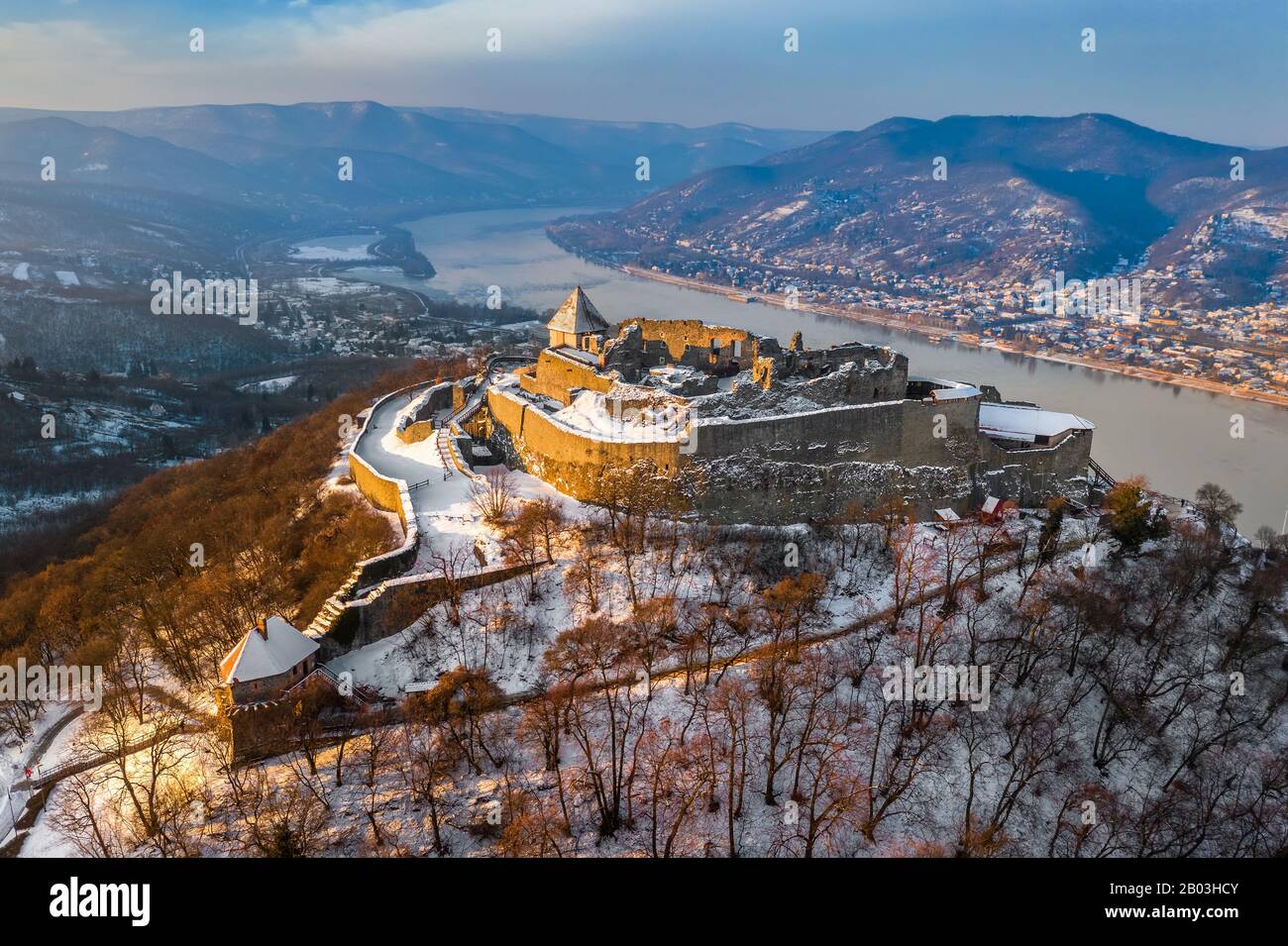 Visegrad, Hungary - Aerial view of the beautiful snowy high castle of Visegrad at sunrise on a winter morning with Dunakanyar at background Stock Photo
