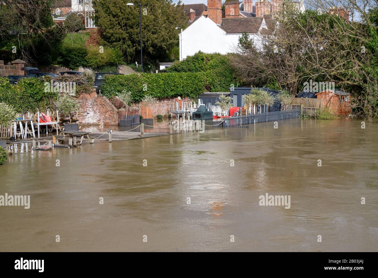 Flooding of the River Severn in Shrewsbury, UK. Flooding the Quarry Park , a children's play area and The Boathouse Pub. Stock Photo