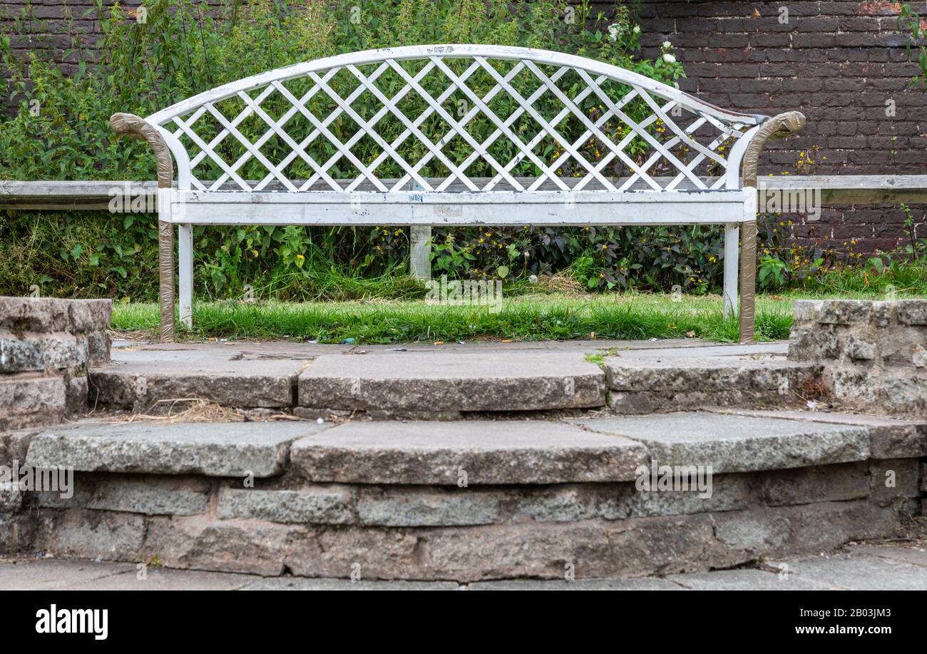 wooden two seater bench in central park wallasey wirral july 2019 Stock Photo