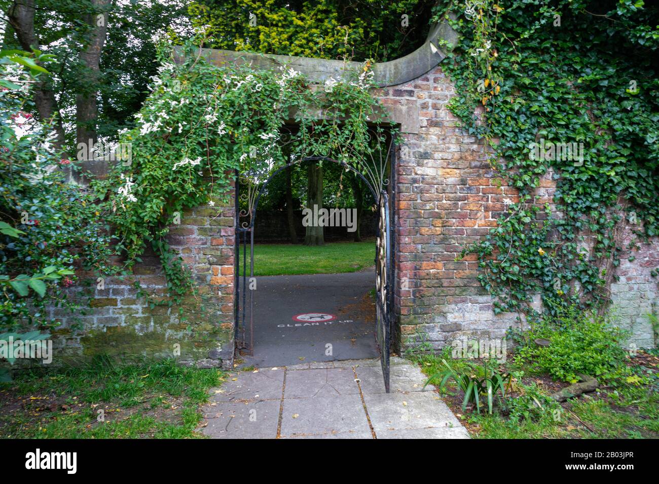 iron gate and brick exit to walled garden in central park wallasey wirral july 2019 Stock Photo