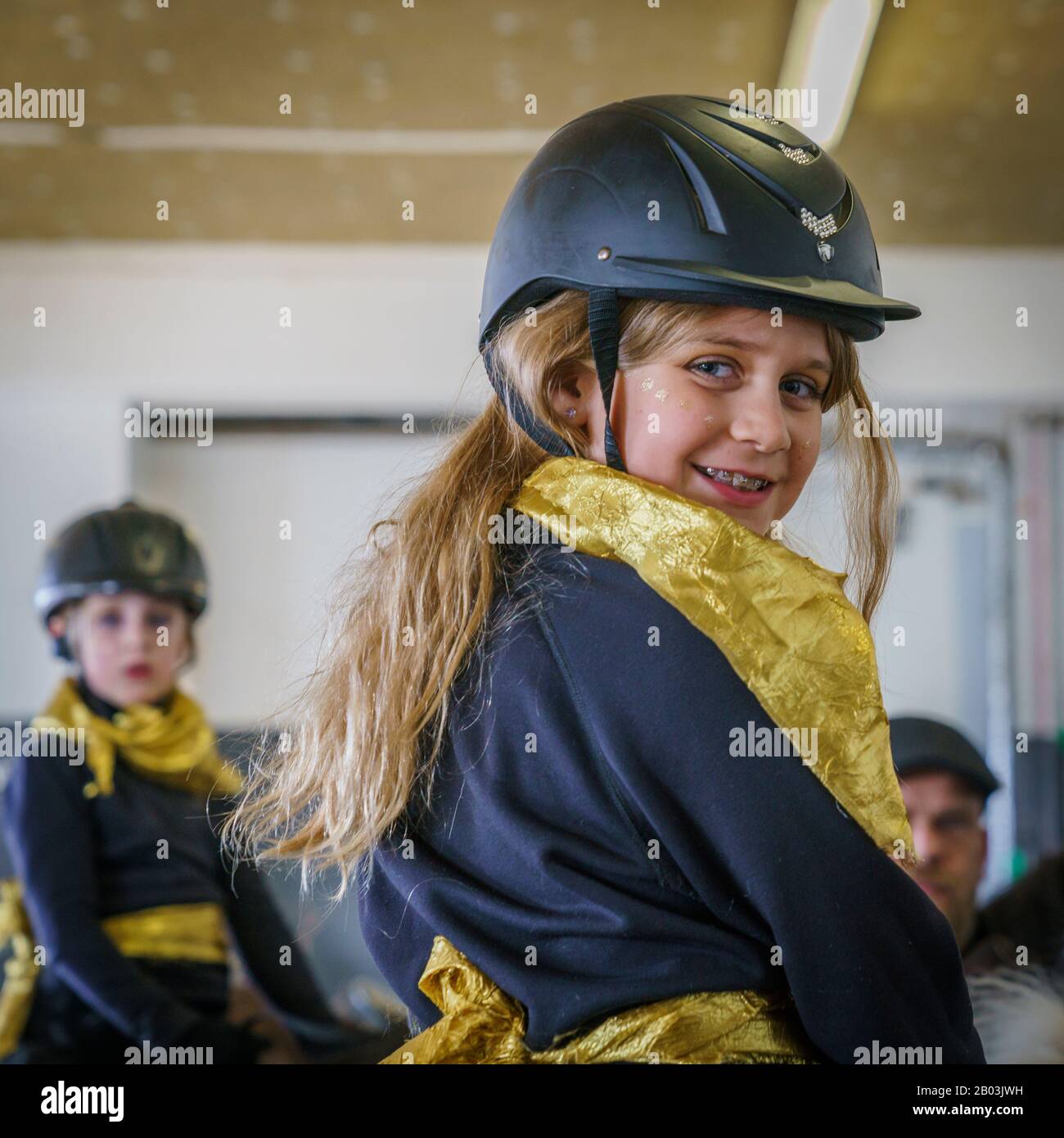 Girl on horseback wearing a helmet, Reykjavik, Iceland Stock Photo