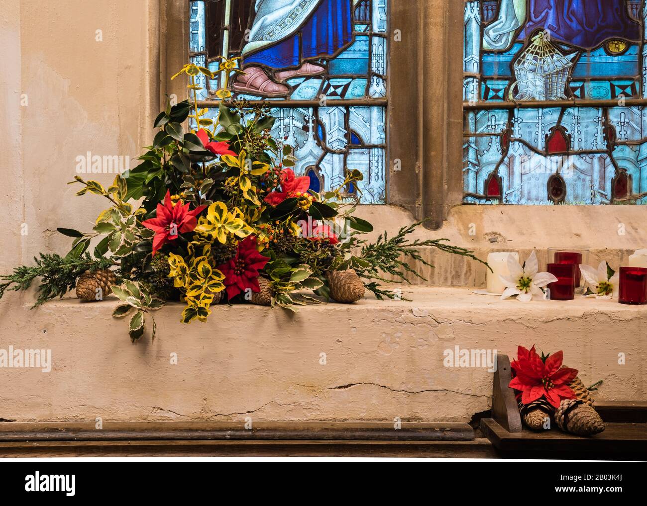 Christmas flower display at All Saints Church in East Budleigh. Stock Photo