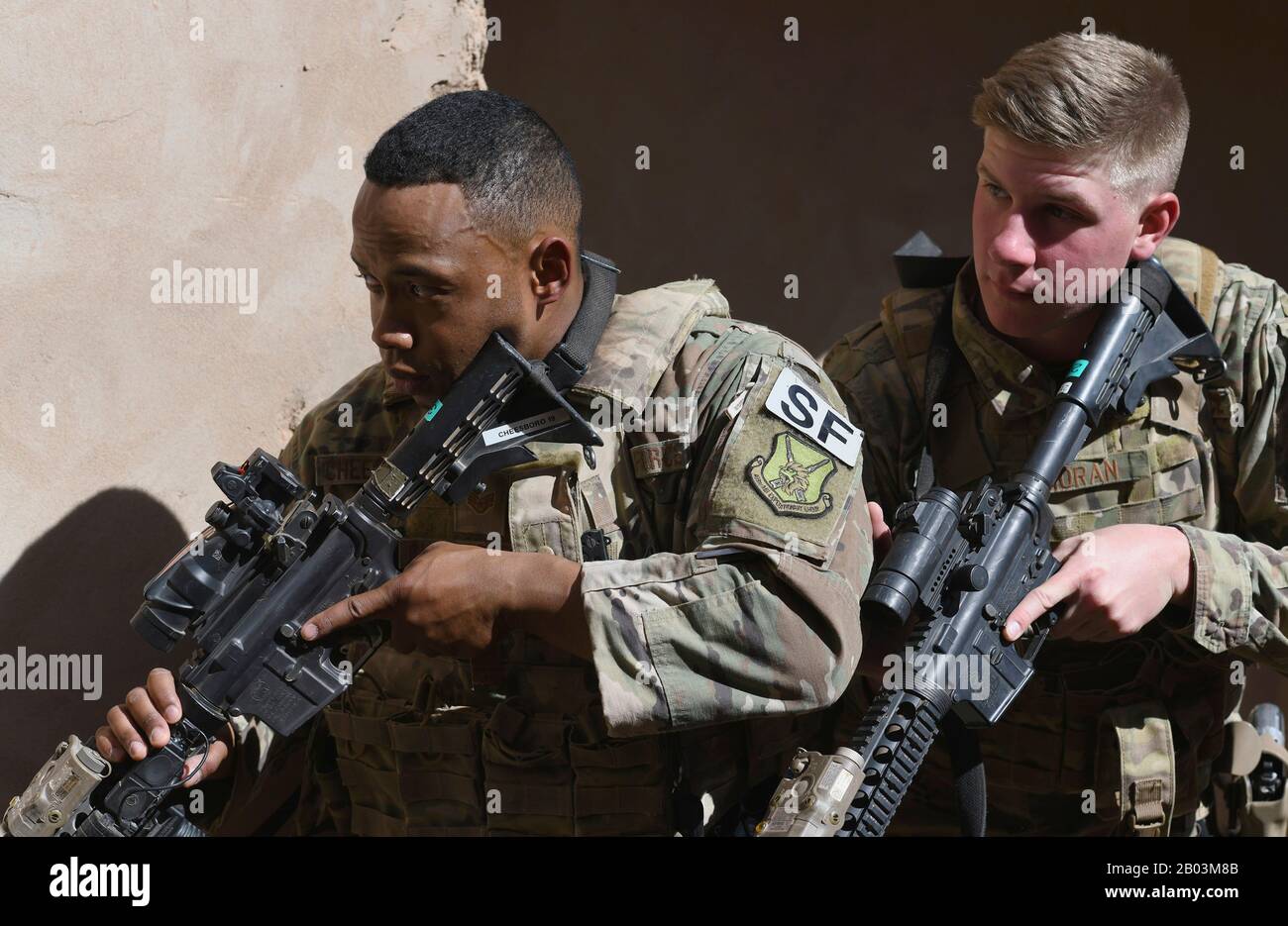 U.S. Air Force Staff Sgt. Noel Cheeseboro, left, and Airman 1st Class Ian Moran, 409th Expeditionary Security Forces Squadron Response Force team members, conduct building clearing procedures during a close quarters battle refresher course at Nigerian Air Base 201 February 5, 2020 in Agadez, Niger. Stock Photo