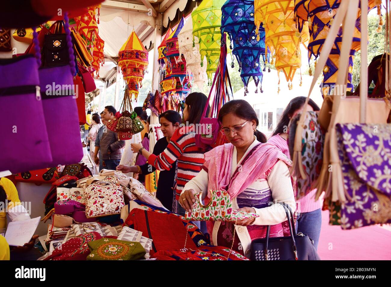 Delhi, India. 18th Feb, 2020. Visitors checking out various commodities during the festival.Hunar Haat festival at India Gate Lawns in Rajpath, is organised by the Union Ministry of Minority Affairs. The 10-day skills festival runs from 13-23 February with master artisans, craftsmen and culinary experts, including more than 50 per cent women, from across the country participating at the Haat. Credit: SOPA Images Limited/Alamy Live News Stock Photo