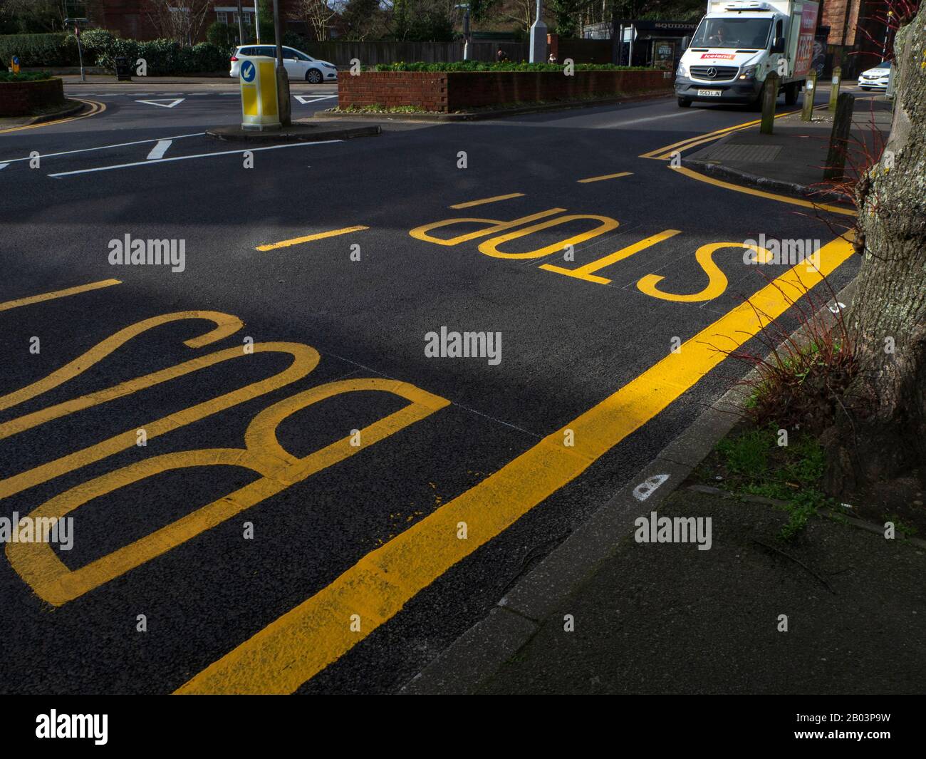 slip road and bus stop with yellow markings Stock Photo Alamy