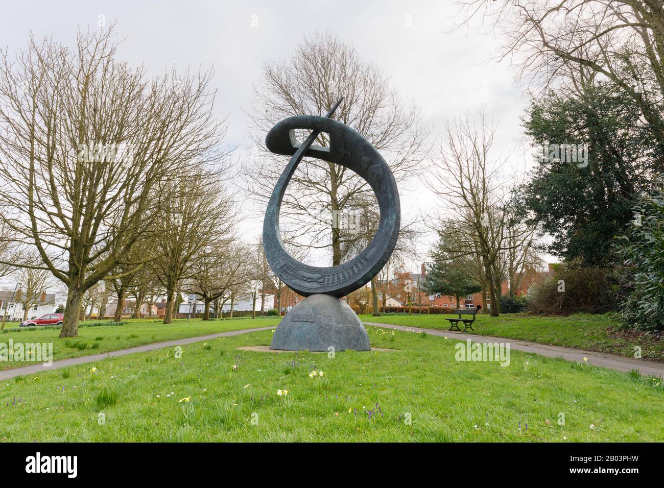 Rugby, UK, February 2020: Sir Frank Whittle Memorial sculpture by Stephen Broadbent stands in Chestnut Fields public space surrounded by mature trees. Stock Photo