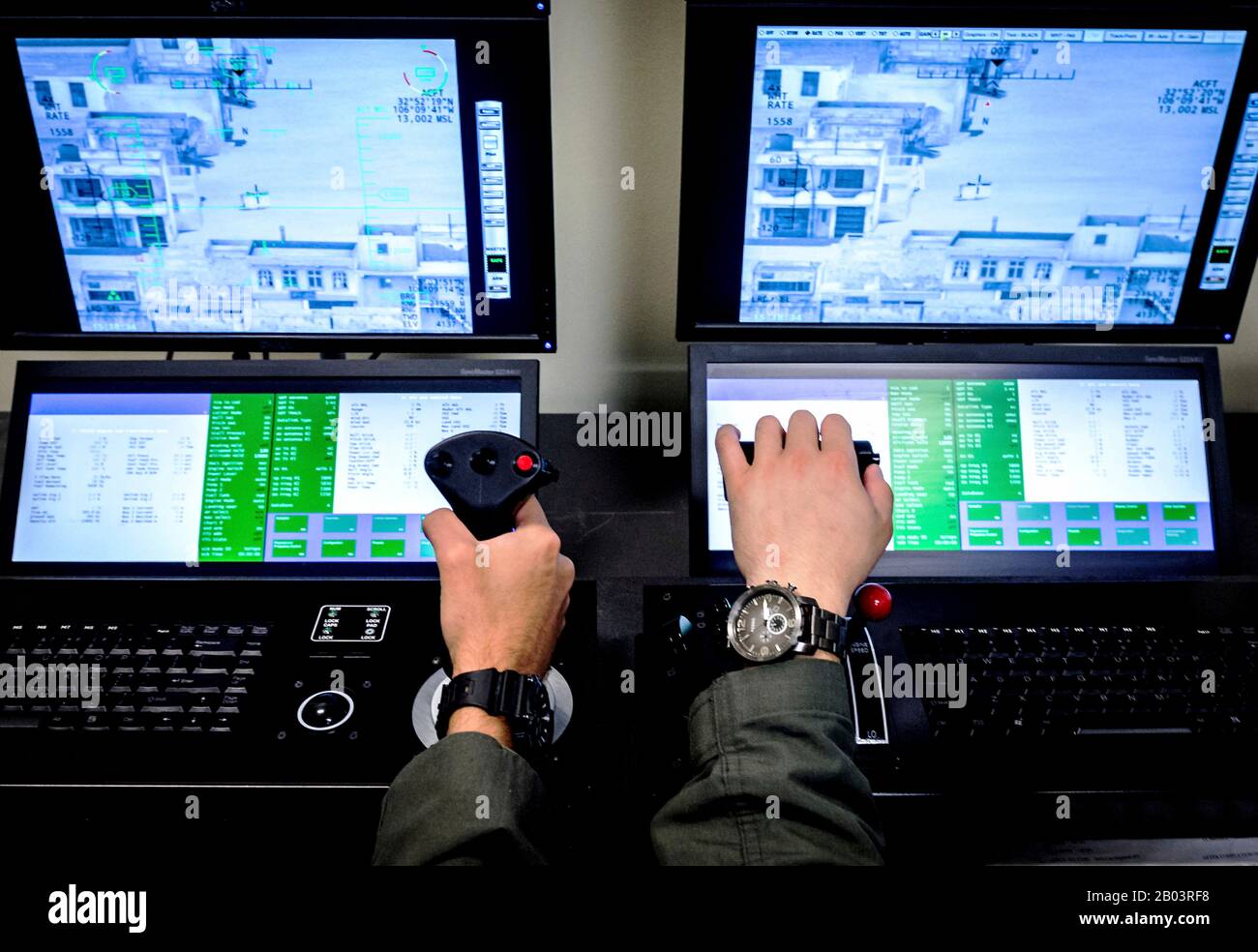 A U.S. Air Force student pilot operates controls during a Predator Reaper drone mission flight simulator at the 558th Flying Training Squadron, Joint Base San Antonio July 17, 2018 in San Antonio, Texas. Student pilots spend 85 days in the RPA Instrument Qualification course and 30 days in the RPA Fundamentals Course during the second phase of the Air Education and Training Command pilot curriculum. Stock Photo