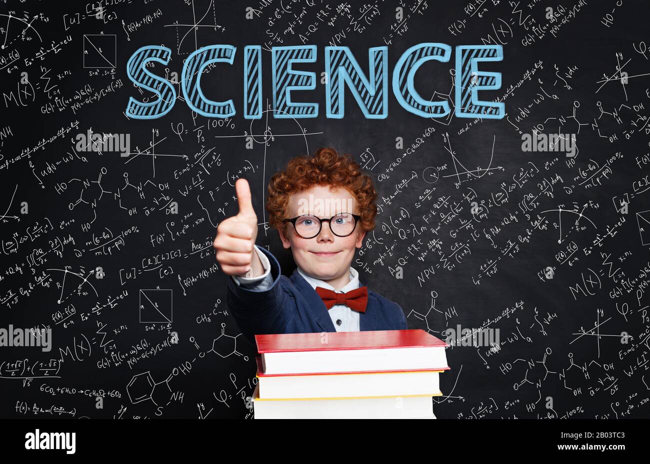 Successful smart kid wearing glasses and student uniform on science background Stock Photo