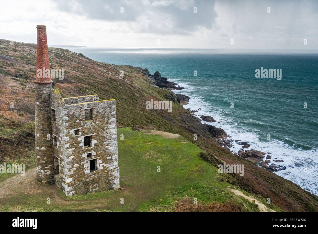 MIne house on Cornish cliffs overlooking rough sea. Stock Photo