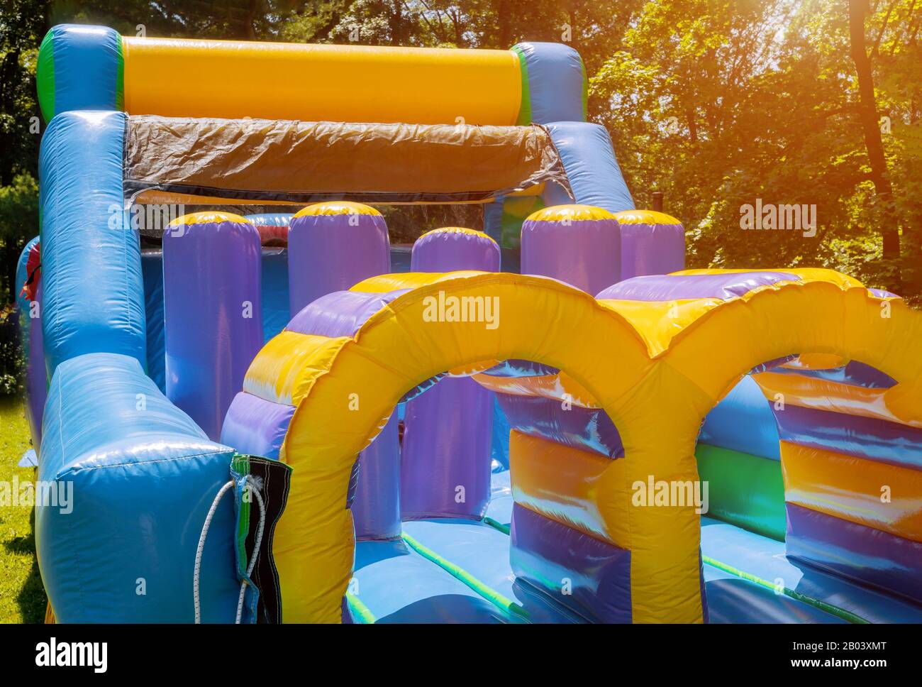 Jumps on a big inflatable trampoline castle labyrinth Stock Photo Alamy