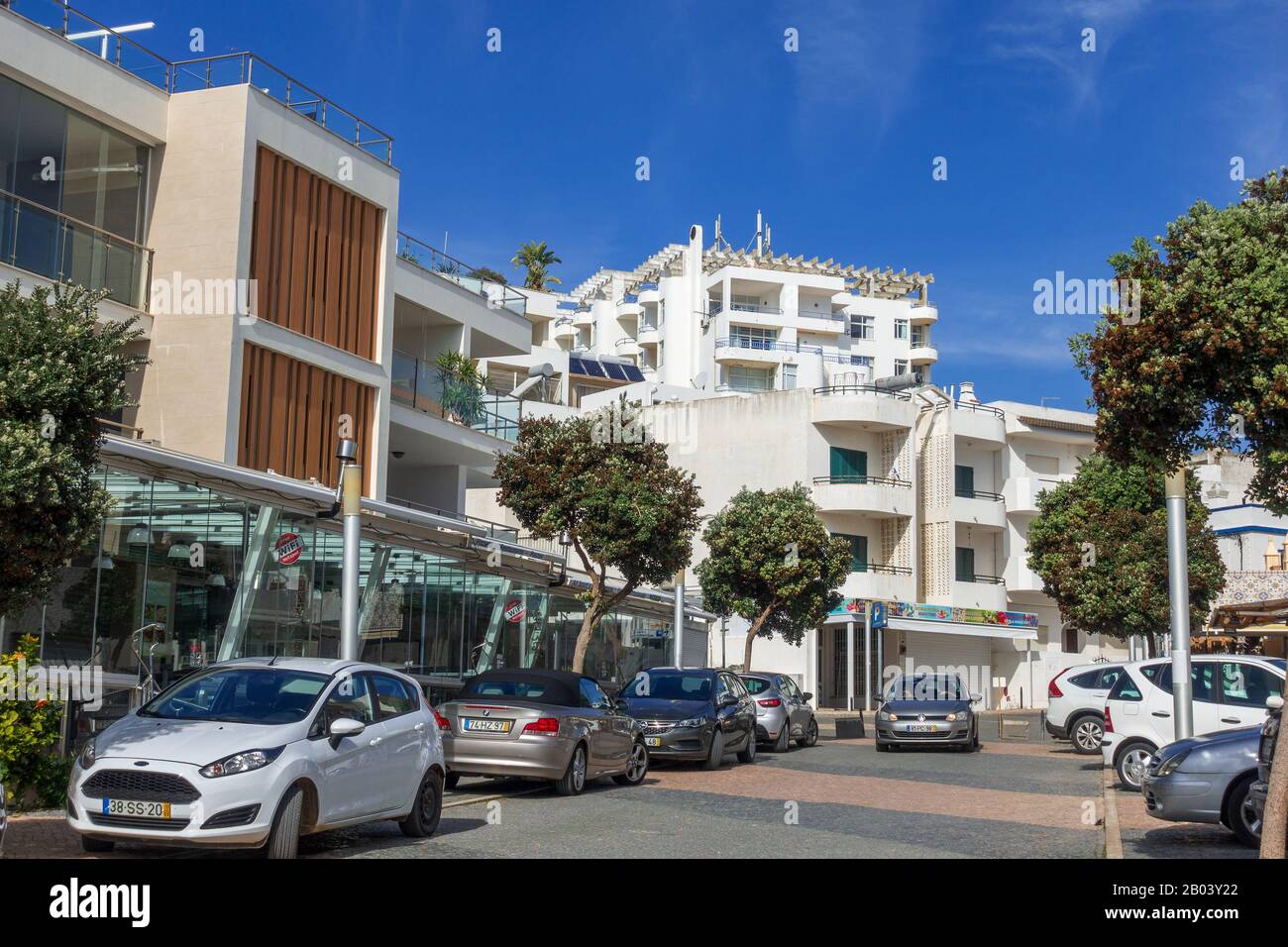 Shops And Restaurants On The Main Street Of Olhos De Agua A Popular Resort Town In The Algarve Portugal Stock Photo