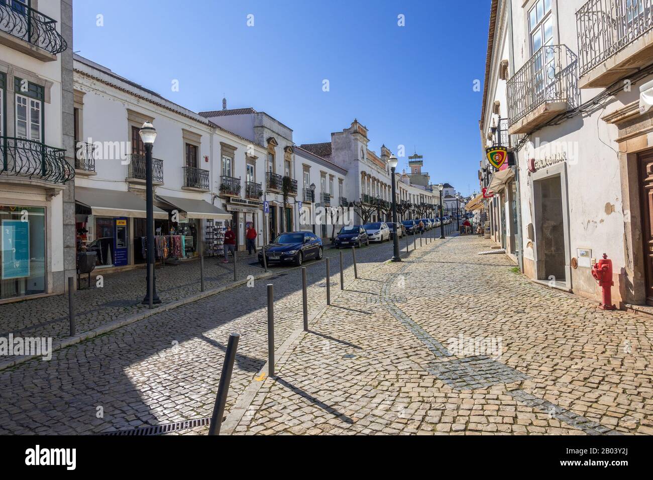 Rua Da Liberdade (Liberty Street), In Tavira The Algarve Portugal, A main shopping street leading to the town hall, the main city square Praca da Repu Stock Photo