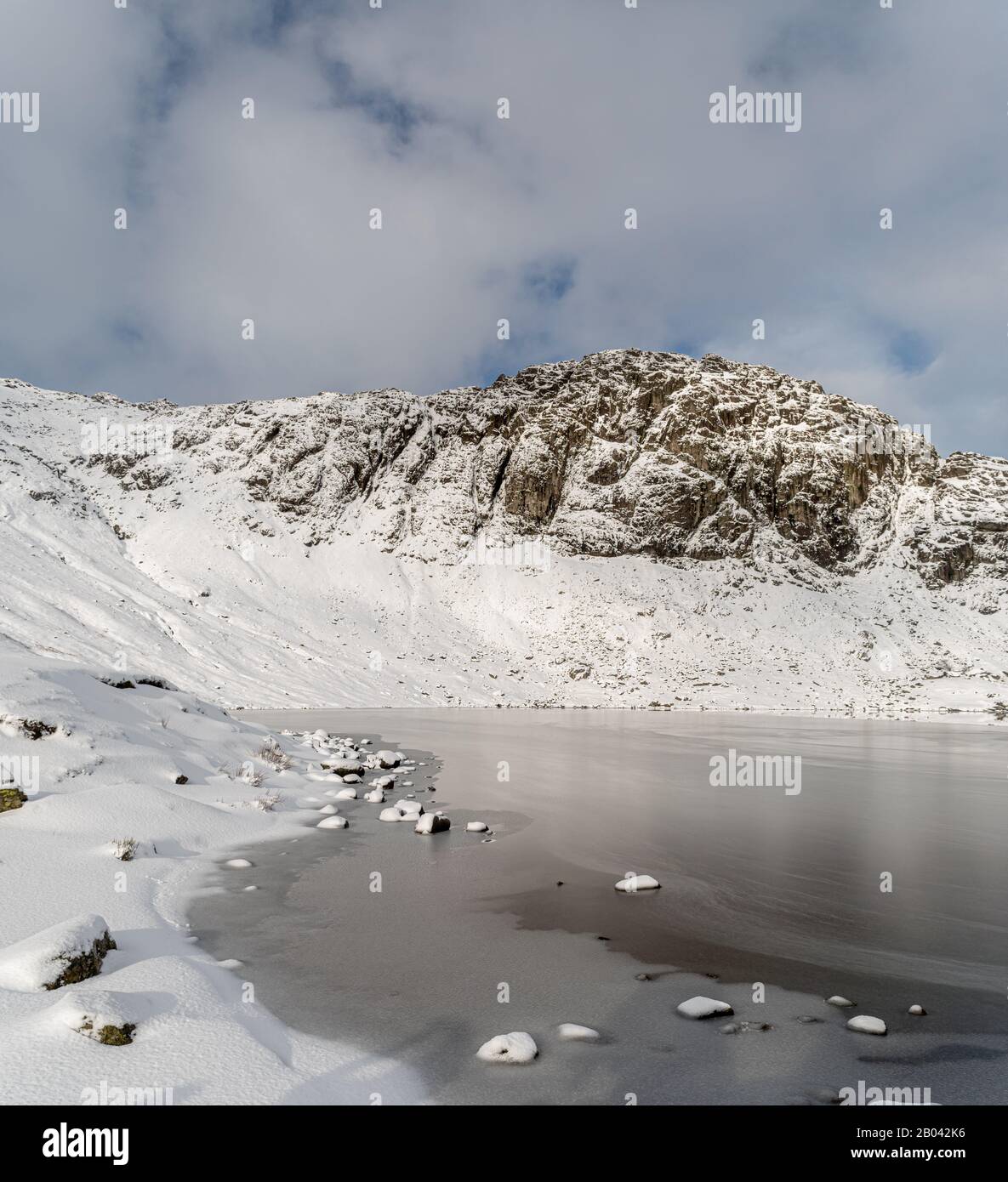 Pavey Arc and Stickle Tarn with fresh snow Stock Photo