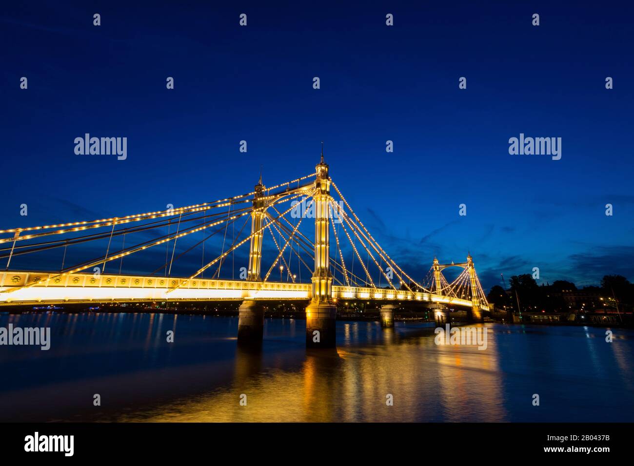 The Albert Bridge, London, at night with lights and sunset Stock Photo