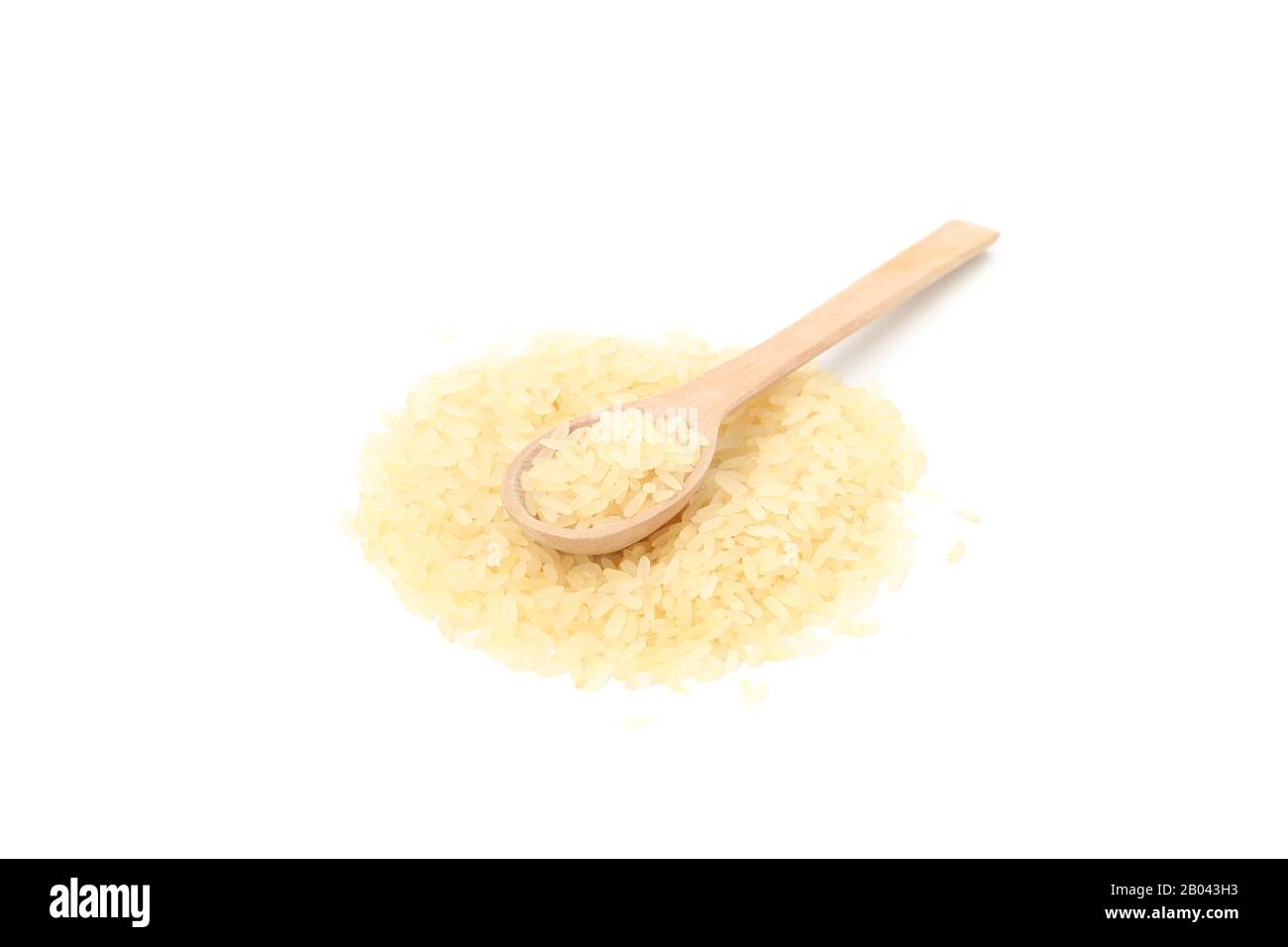 Wooden spoon and rice isolated on white background Stock Photo - Alamy