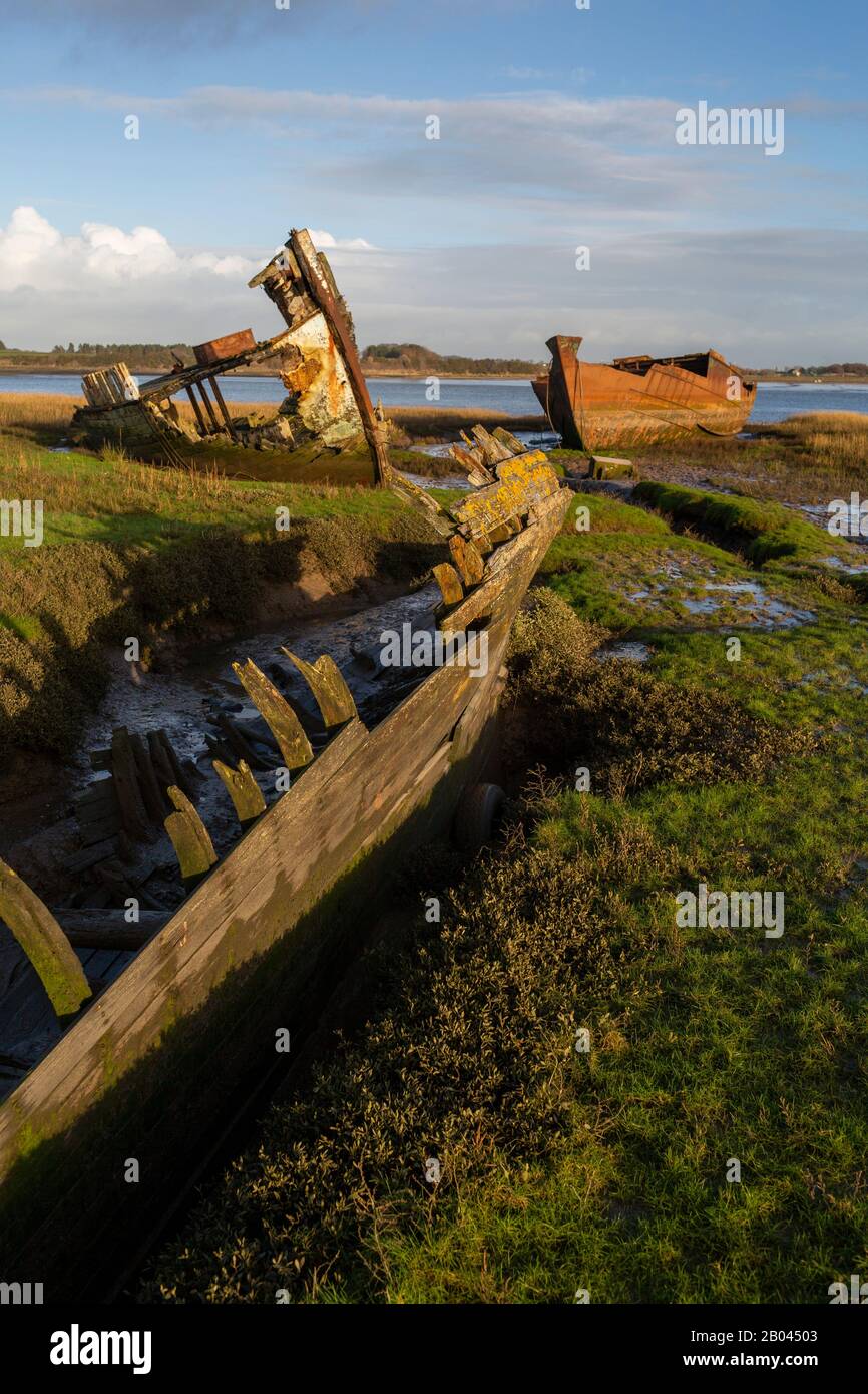 Fleetwood , Lancs - Fishing Industry decline - The rotting hulks of old boats decay in the sands of Fleetwood Marshes next to the River Wyre Stock Photo
