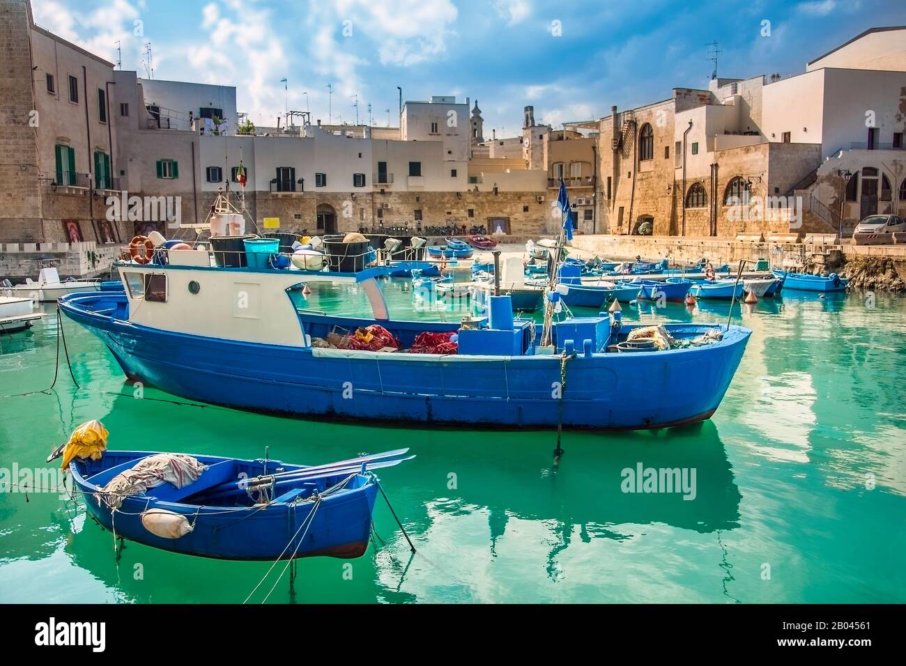 Fishing boats at the old port of Porto Vecchio in Monopoli Puglia Italy Stock Photo