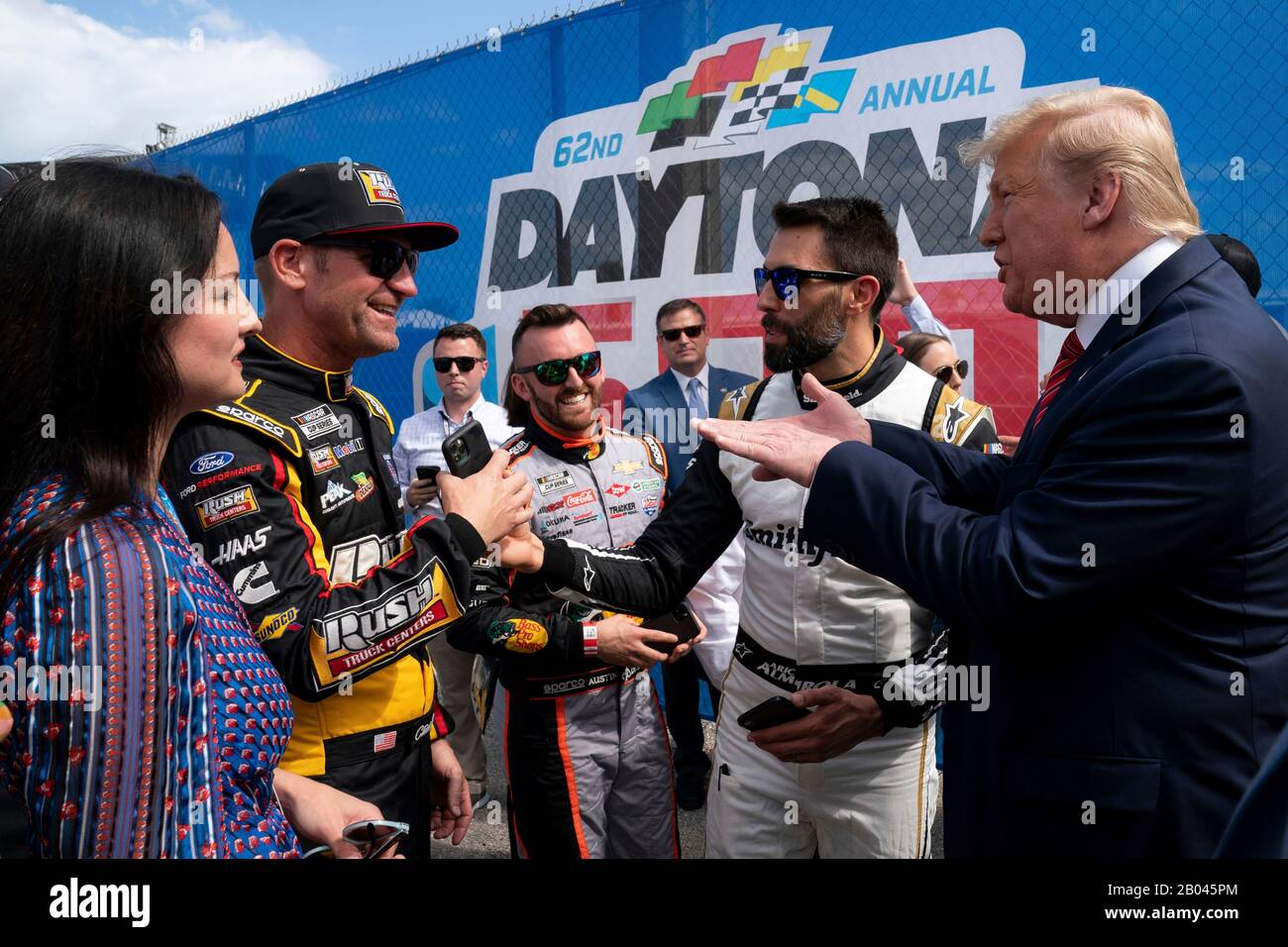 U.S President Donald Trump and First Lady Melania Trump greet NASCAR drivers at Daytona International Speedway February 16, 2020 in Daytona Beach, Florida. Trump served as the official starter of the the NASCAR Daytona 500 auto race and took a ride in the presidential limousine around the track. Stock Photo