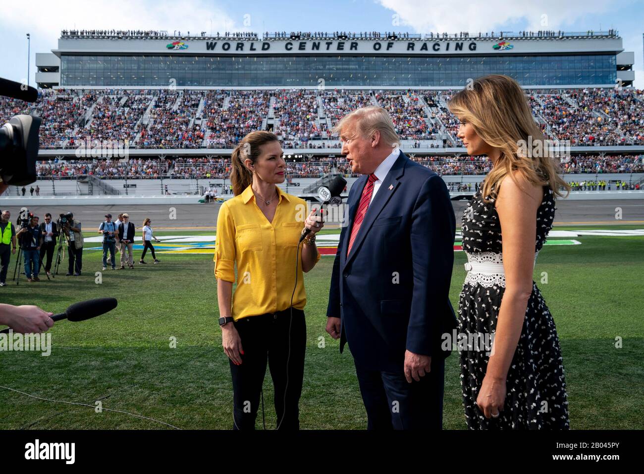 U.S President Donald Trump and First Lady Melania Trump are interviewed by Jamie Little of Fox Sports at Daytona International Speedway February 16, 2020 in Daytona Beach, Florida. Trump served as the official starter of the the NASCAR Daytona 500 auto race and took a ride in the presidential limousine around the track. Stock Photo