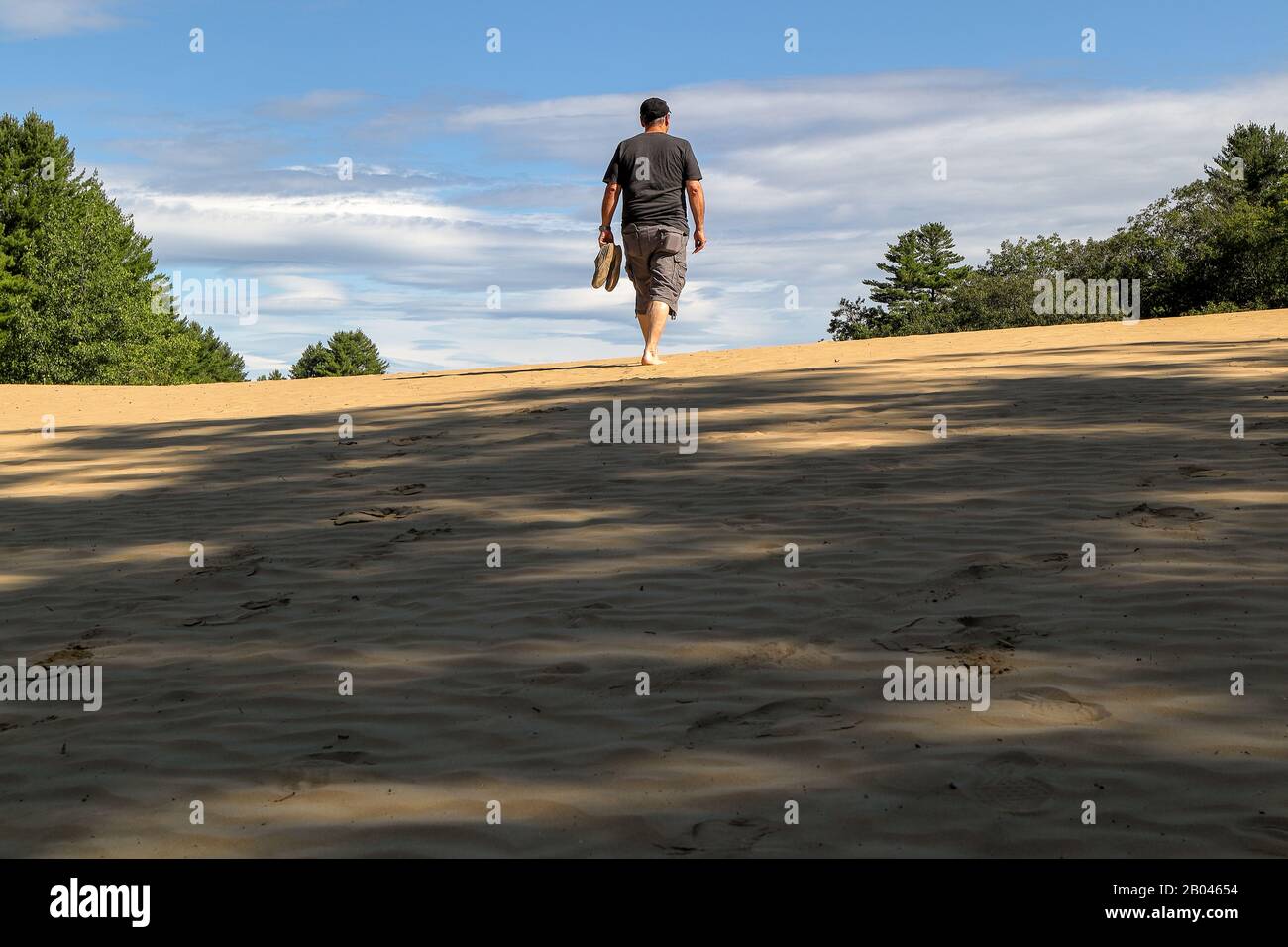 A man hiking in the beautiful Desert of Maine park near Freeport, Maine Stock Photo