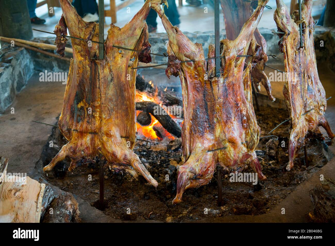 Asado (traditional lamb barbecue) in Puerto Chacabuco in the Chilean Fjords in southern Chile. Stock Photo